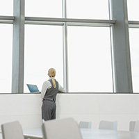 woman-with-laptop-contemplating-blog-square-200x200